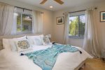 Serene second bedroom: impact windows absorb outside noise